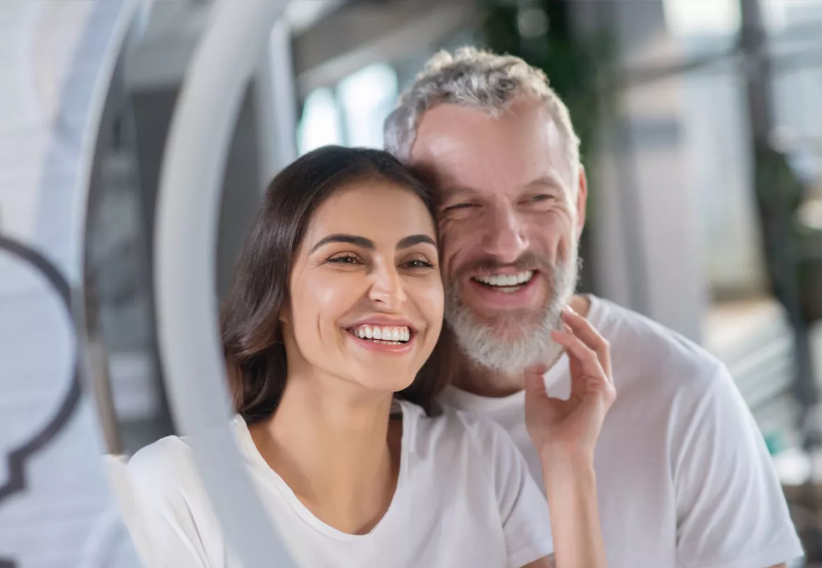 Couple smiling in mirror